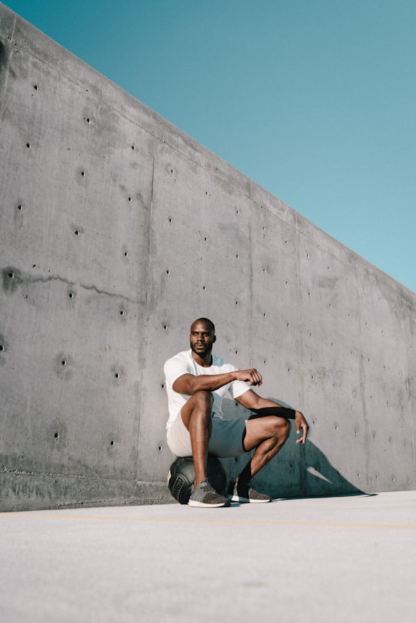 Person performing a rowing movement with dumbbell